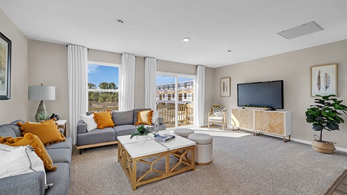 Open concept living room with access to deck