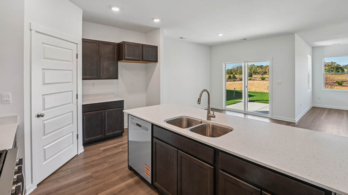 Kitchen island overlooking dining room and great room