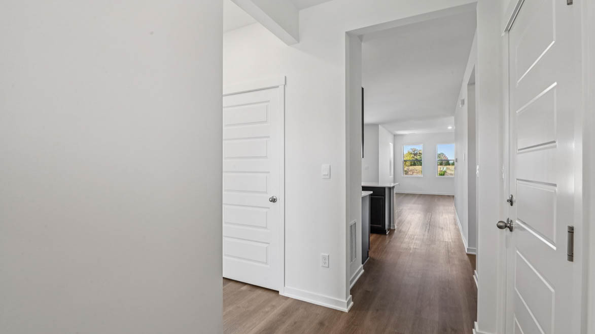 Hallway leading to open concept main living space