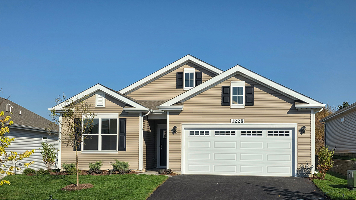 ranch bristol home with tan vinyl siding