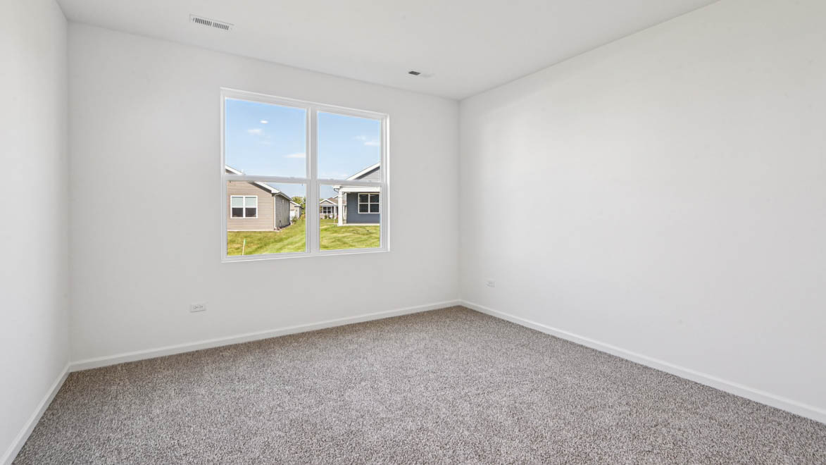 Primary bedroom with carpet
