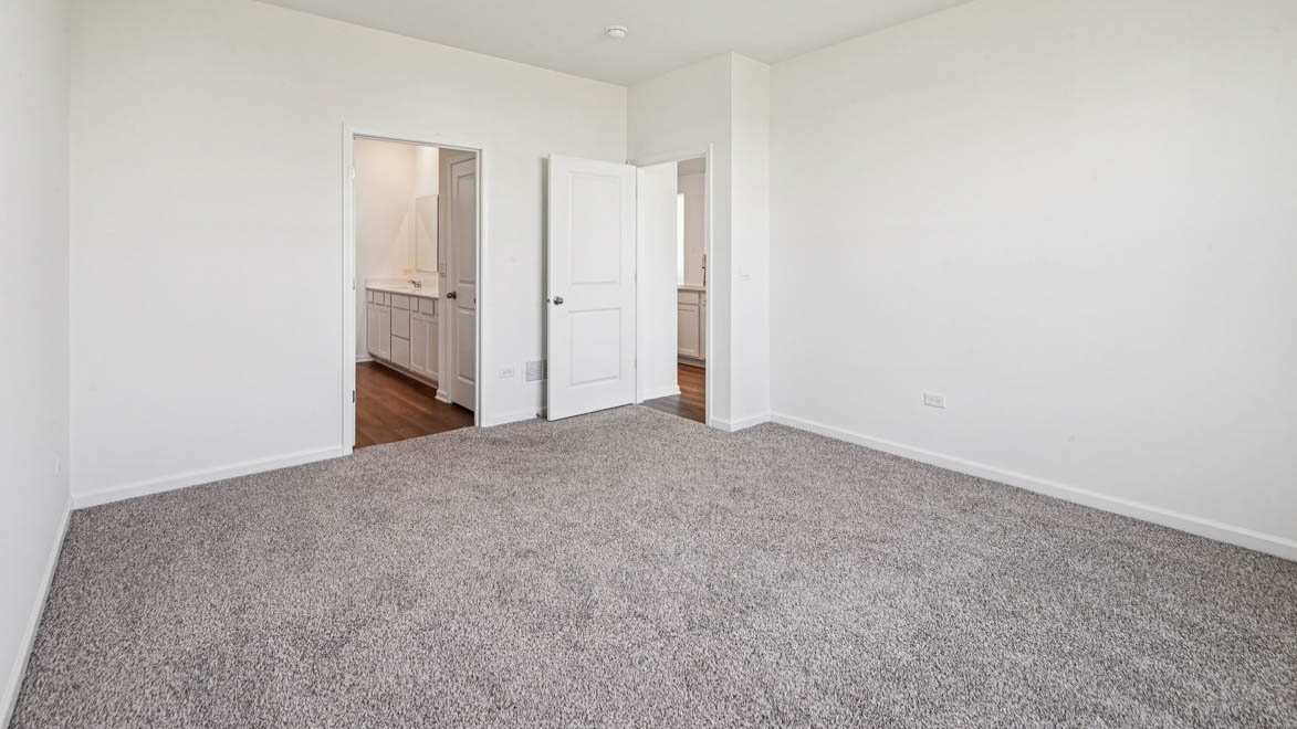 Primary bedroom with connecting en suite