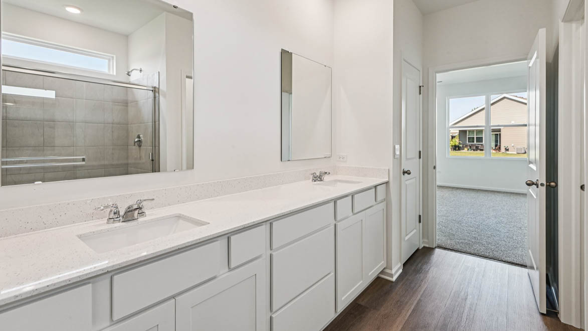 Primary bathroom with linen closet and water closet