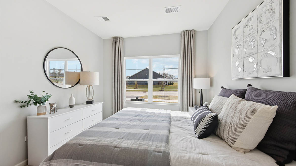 secondary bedroom with carpeted flooring and large window