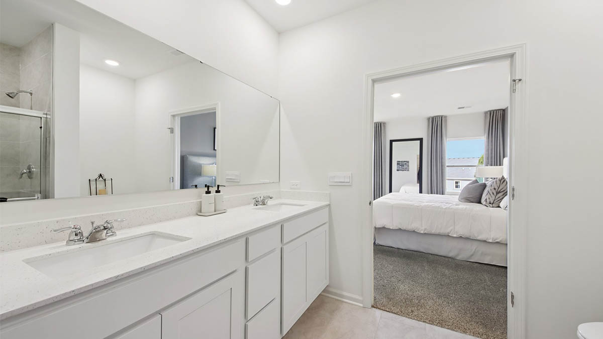 primary en suite bathroom with double bowl vanity