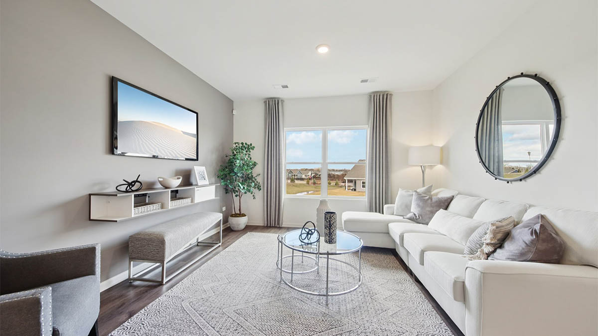 spacious living room with large windows and natural light