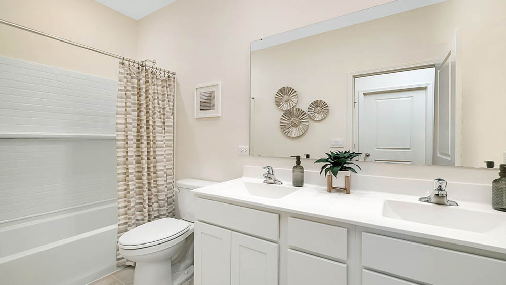Secondary full bathroom with dual sinks