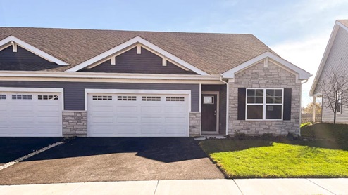 Exterior photo of taylor duplex model with stone and vinyl siding