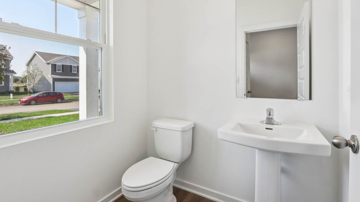 Powder room off of garage entrance