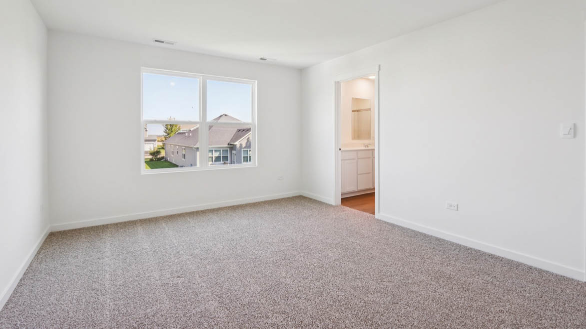 Primary bedroom with connecting en suite
