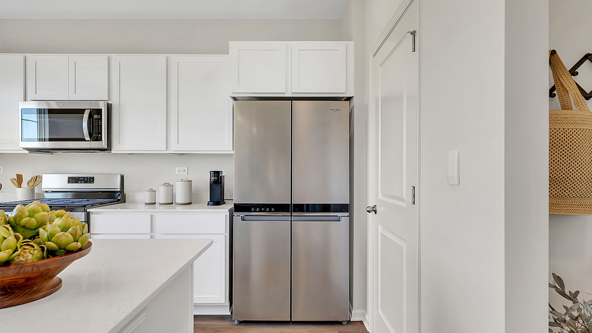 Kitchen with stainless steel appliances and mud room off of garage entrance