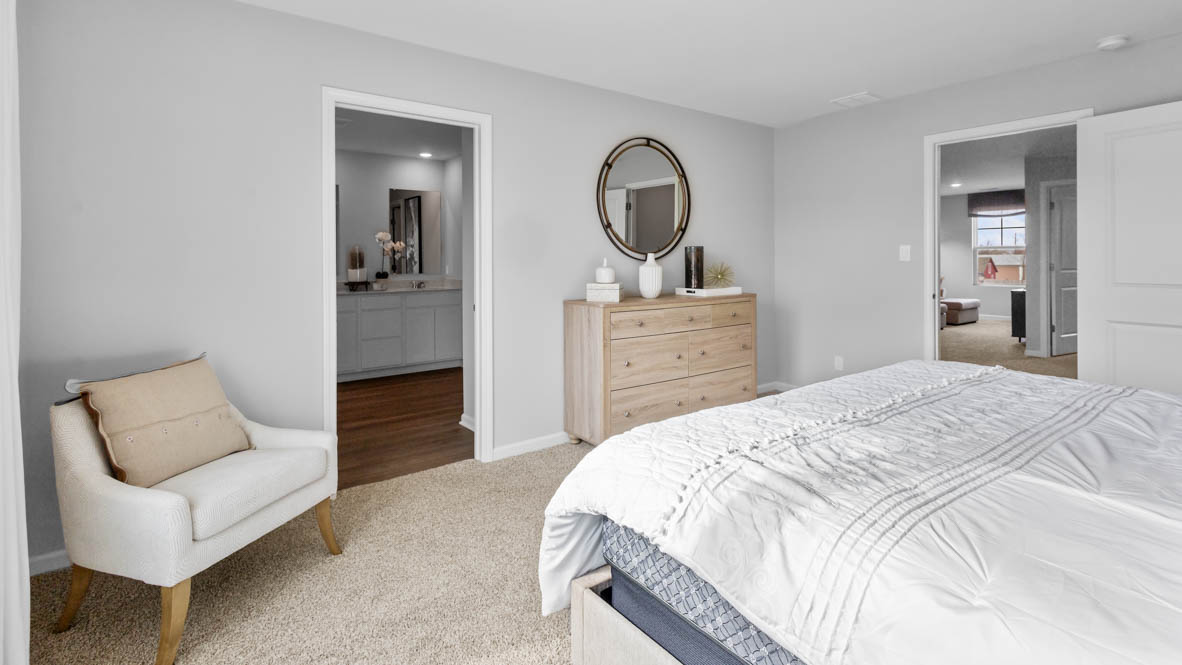 Primary bedroom with connecting en suite