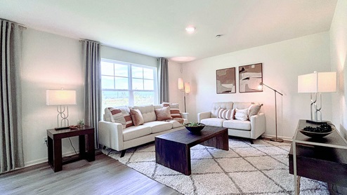 Open concept living with large windows