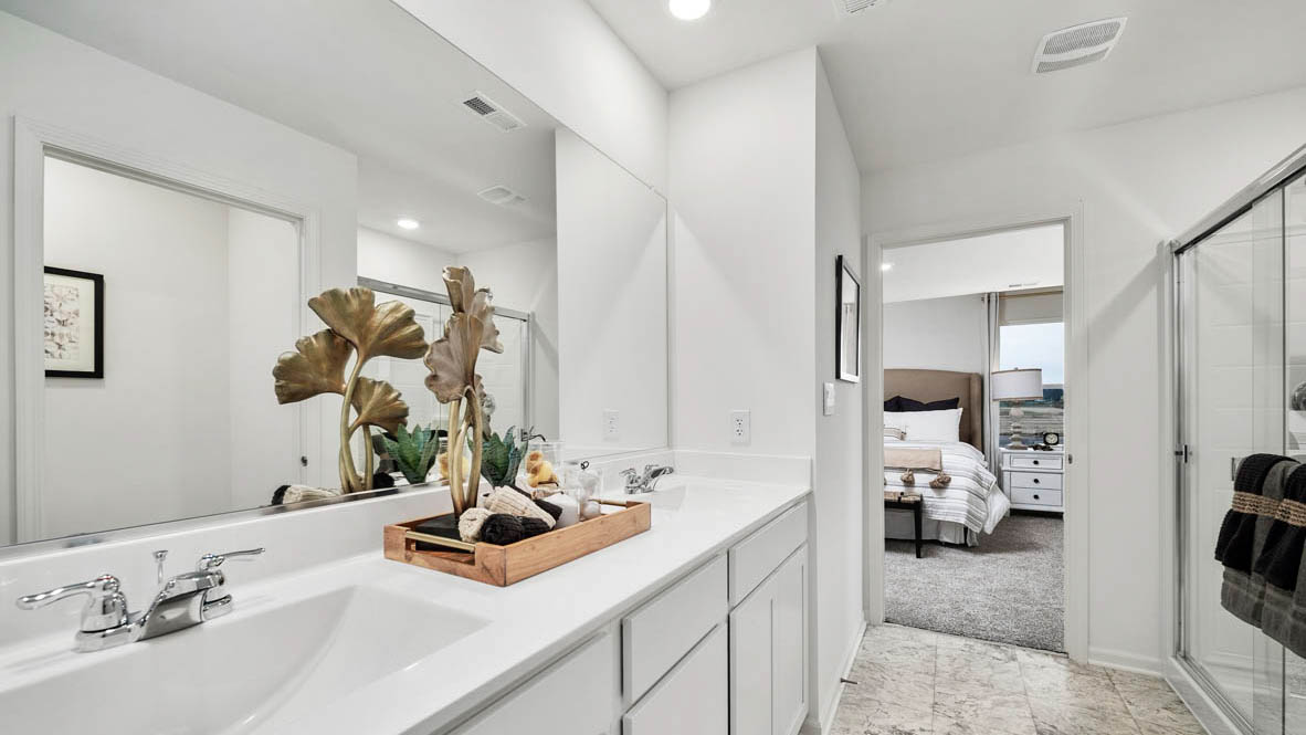 Primary bathroom with dual vanity sinks