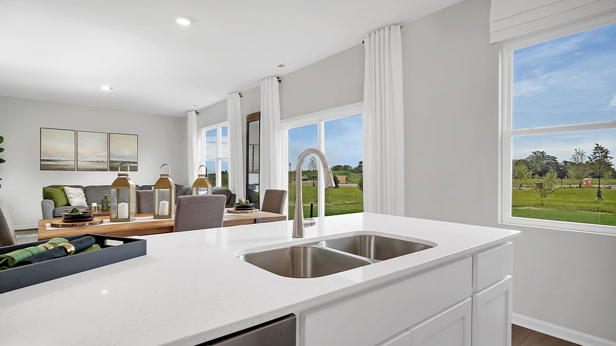 Kitchen overlooking dining room and great room