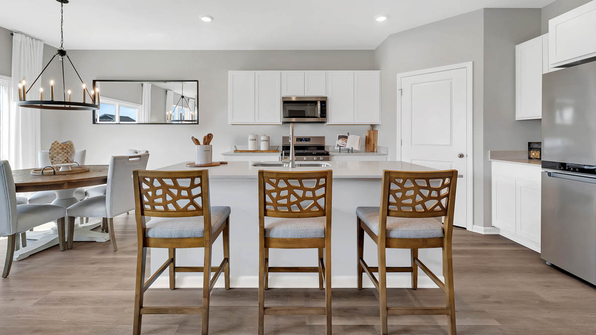 Kitchen with large island with sink and dishwasher