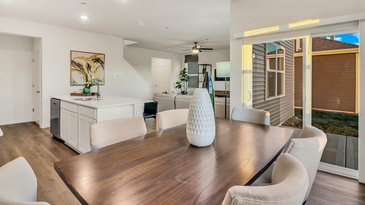 Dining room to the right of kitchen with sliding door to backyard