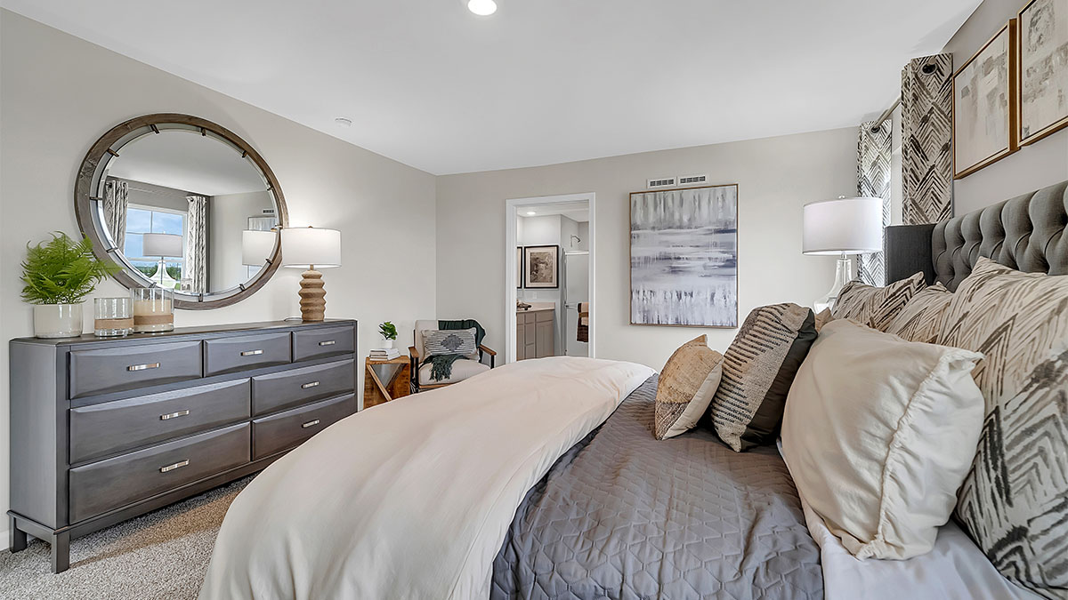 Spacious primary bedroom with connecting en suite