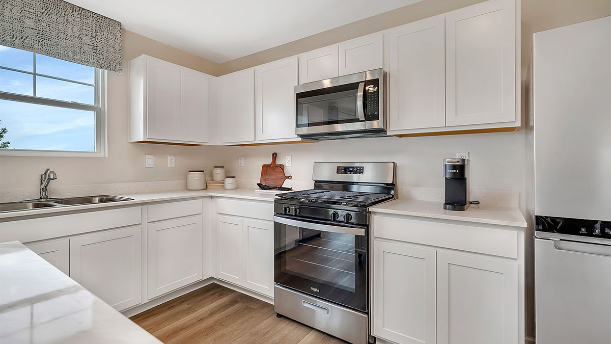 Kitchen with cabinets along the wall