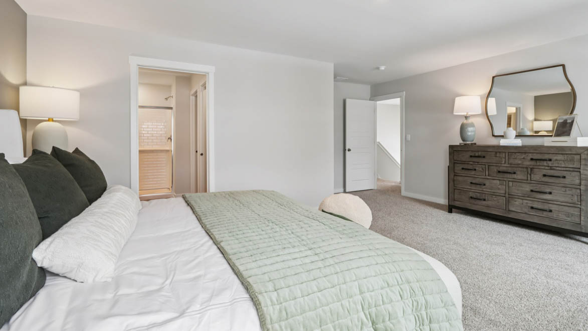 Primary bedroom with connecting en suite