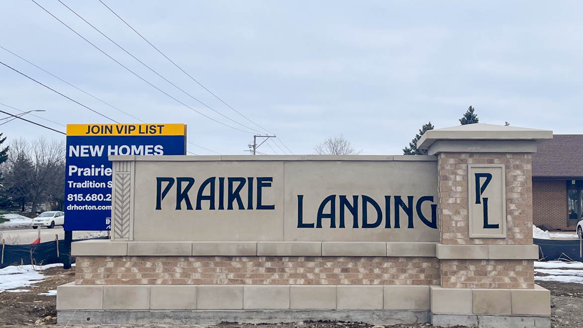 Prairie Landing monument with signage in the background