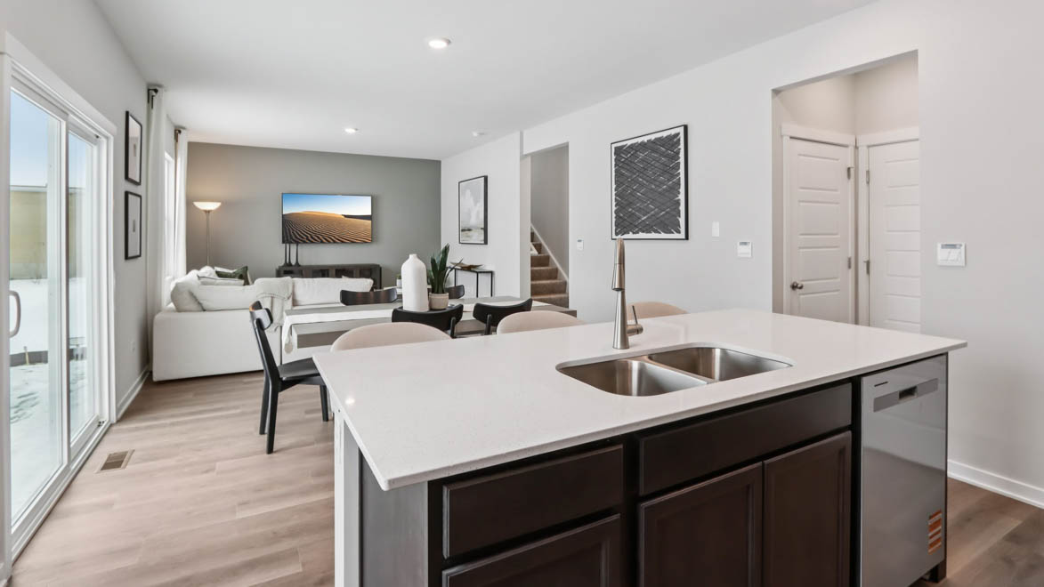 kitchen island overlooking dining room and great room