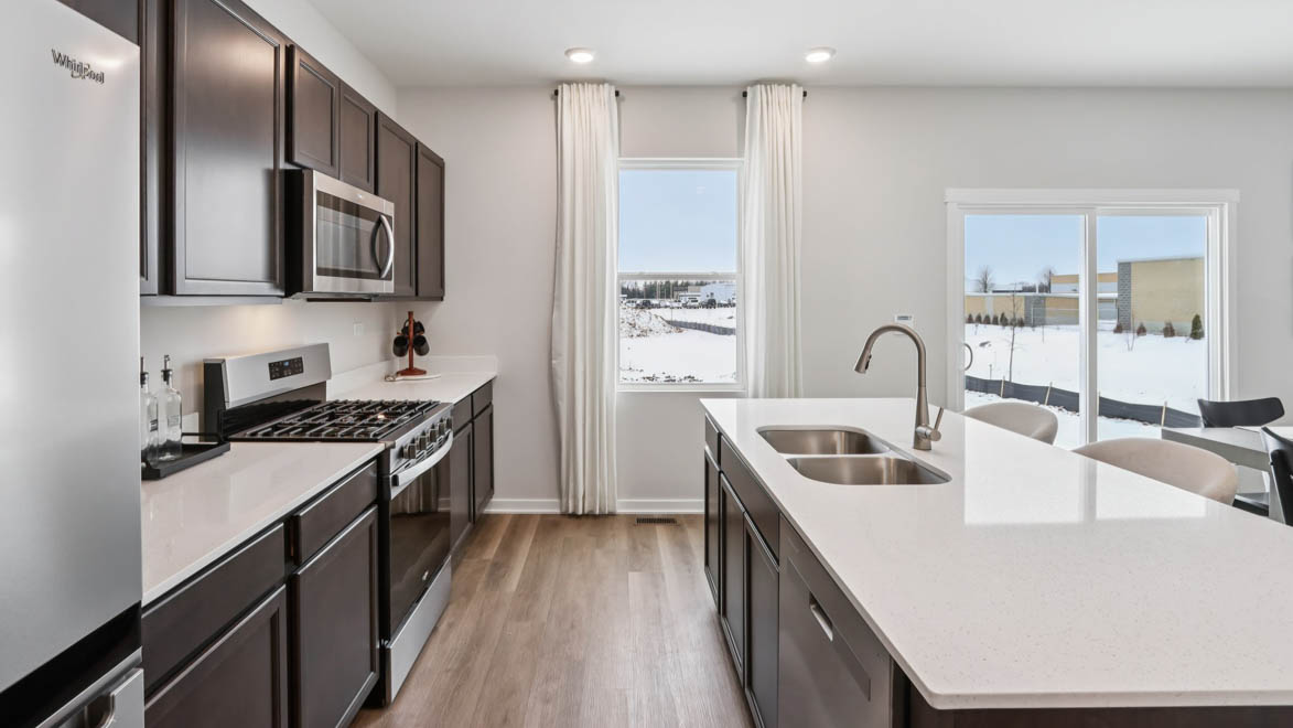 dark cabinets with white quartz countertops