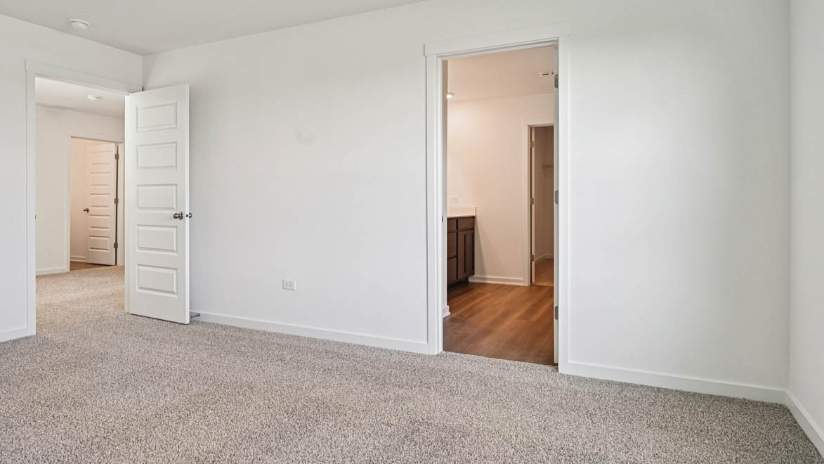 Primary bedroom with connecting en suite