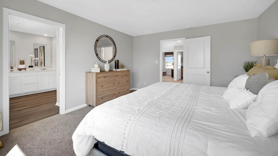 Primary bedroom with connecting en suite