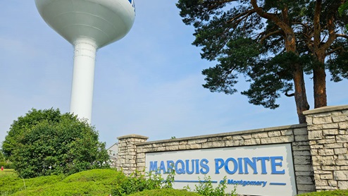 Marquis pointe monument with water tower in the background