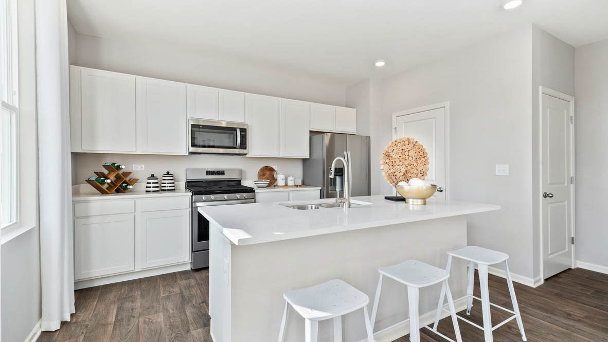 kitchen with white cabinets and white quartz countertops