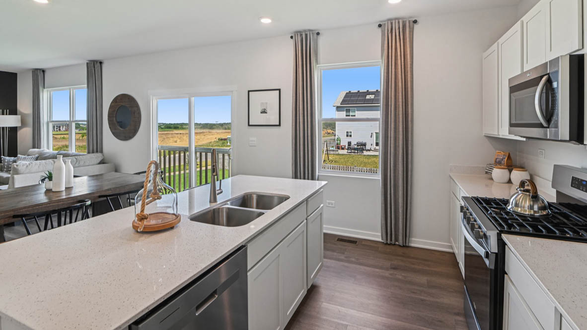 Large kitchen island overlooking dining and great room