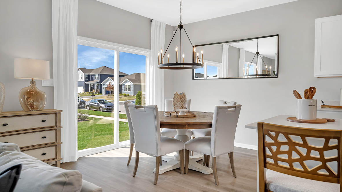 Dining room to the side of kitchen with sliding door to backyar