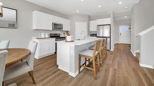 Kitchen with large kitchen island overlooking great room