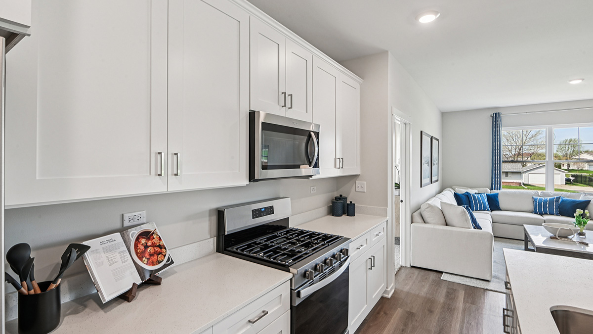open concept kitchen with quartz countertops