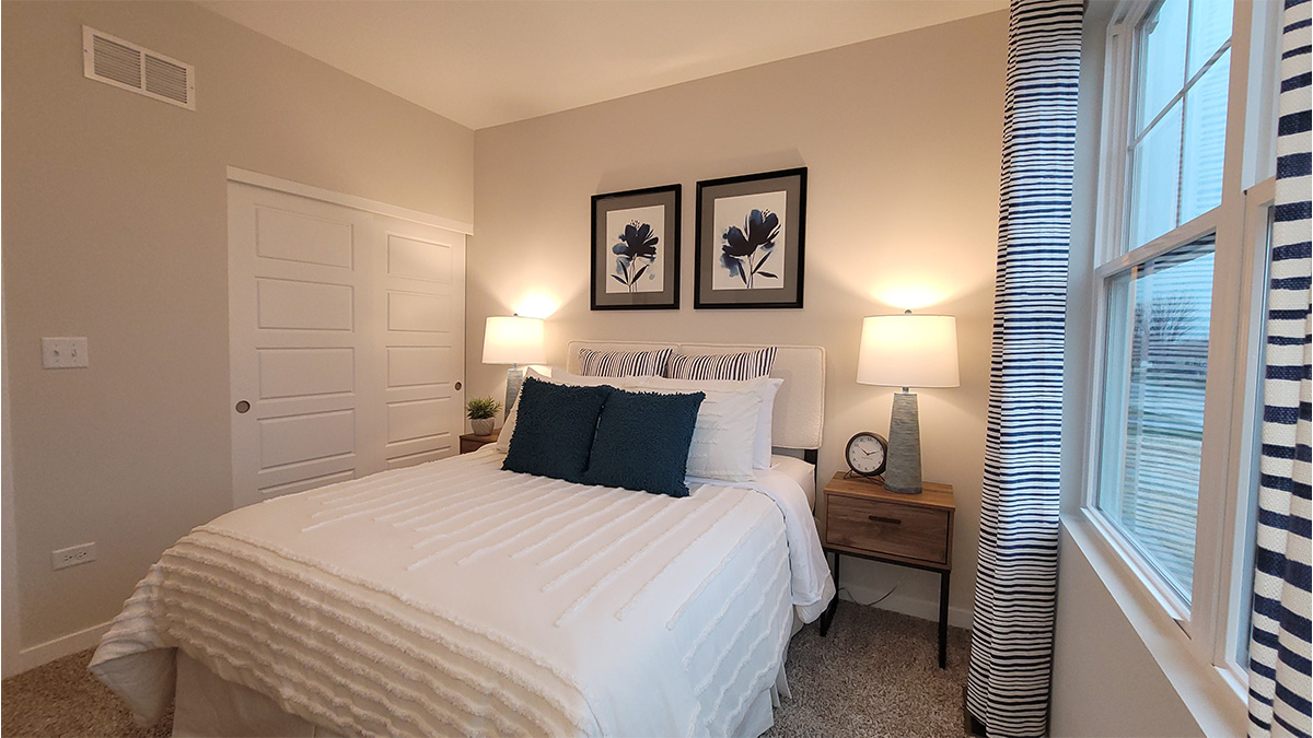primary bedroom with large windows
