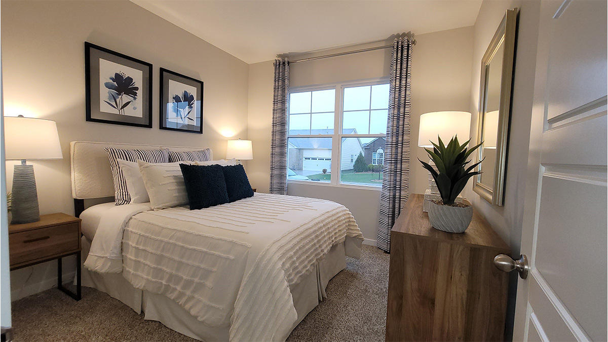 primary bedroom with large windows