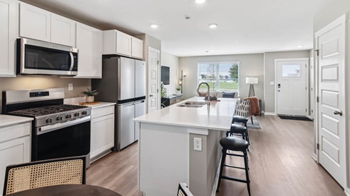 Kitchen in between great room and dining room