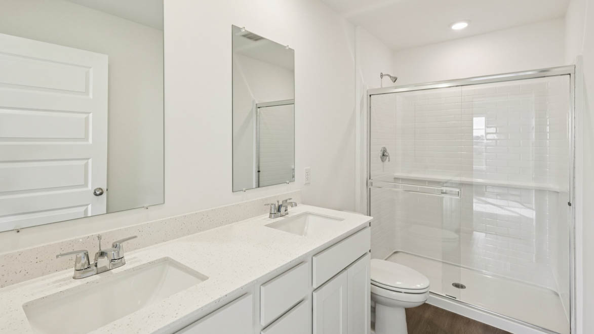 primary en suite bathroom with double bowl vanity