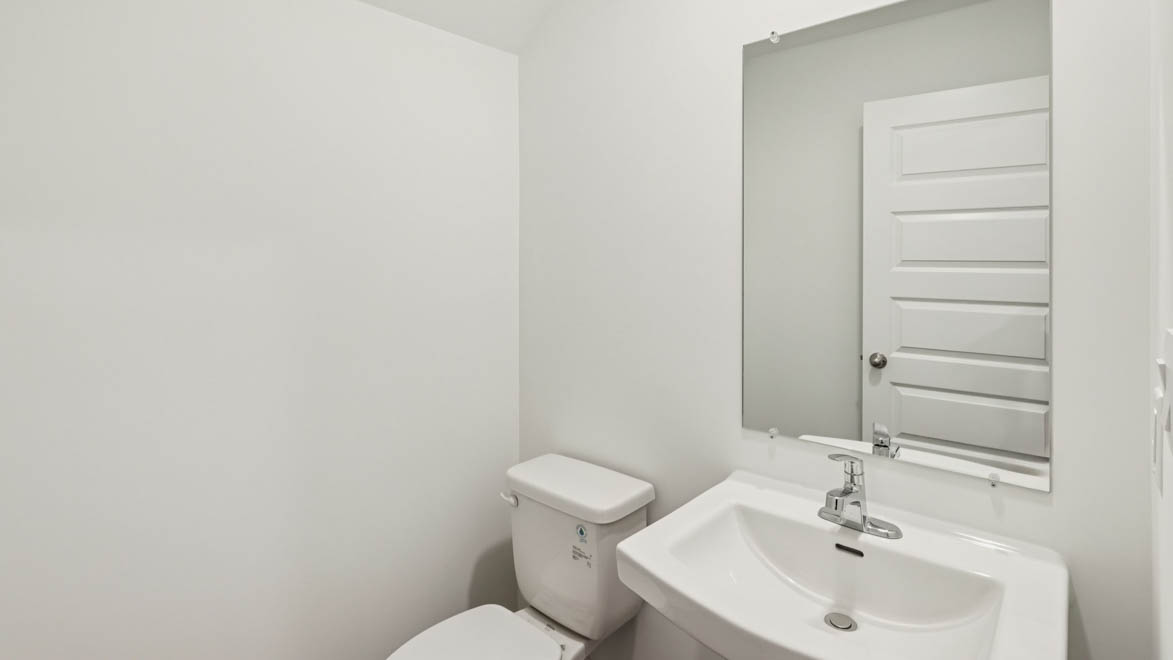 Half bathroom off of mud room from garage entry