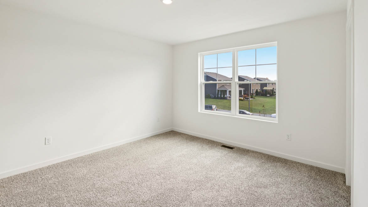 Primary bedroom with large window