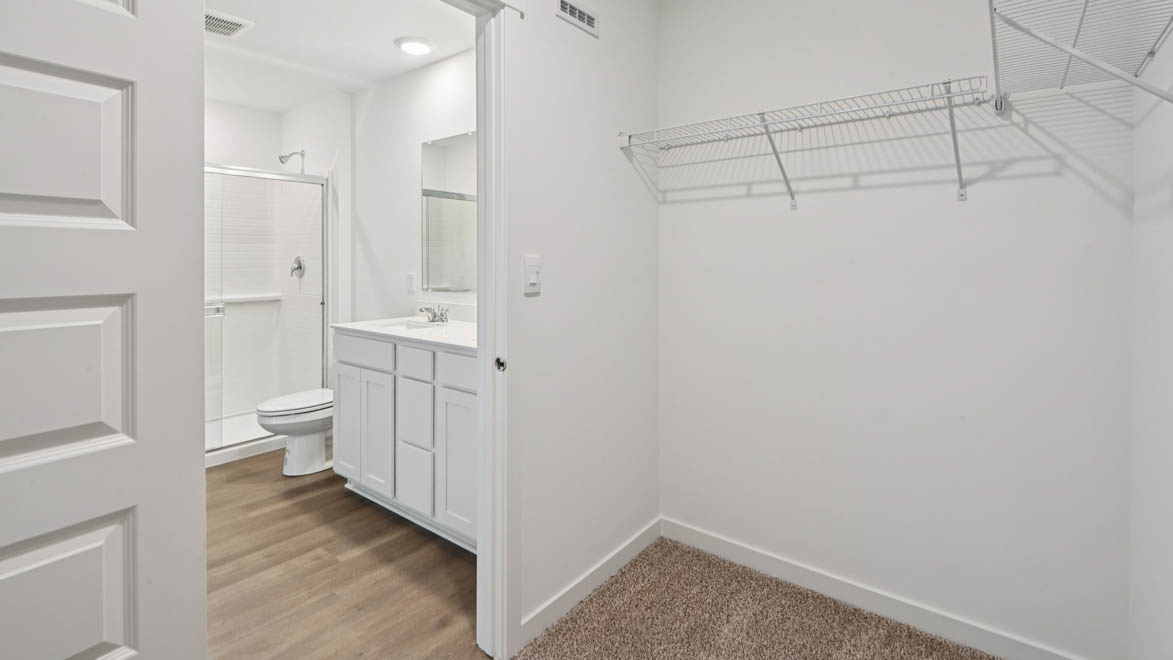 Walk in closet off of primary bathroom