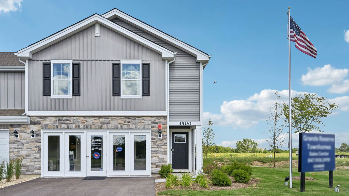 Exterior photo of portsmouth model with grey vinyl siding and stone accents
