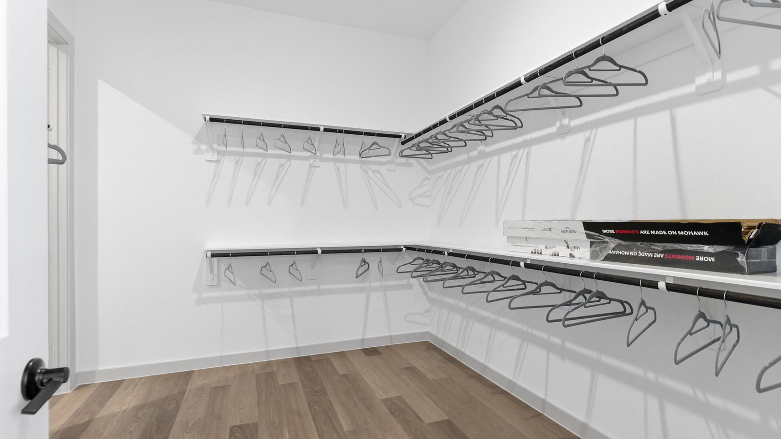 The primary bedroom flows into the en-suite bathroom and walk-in closet