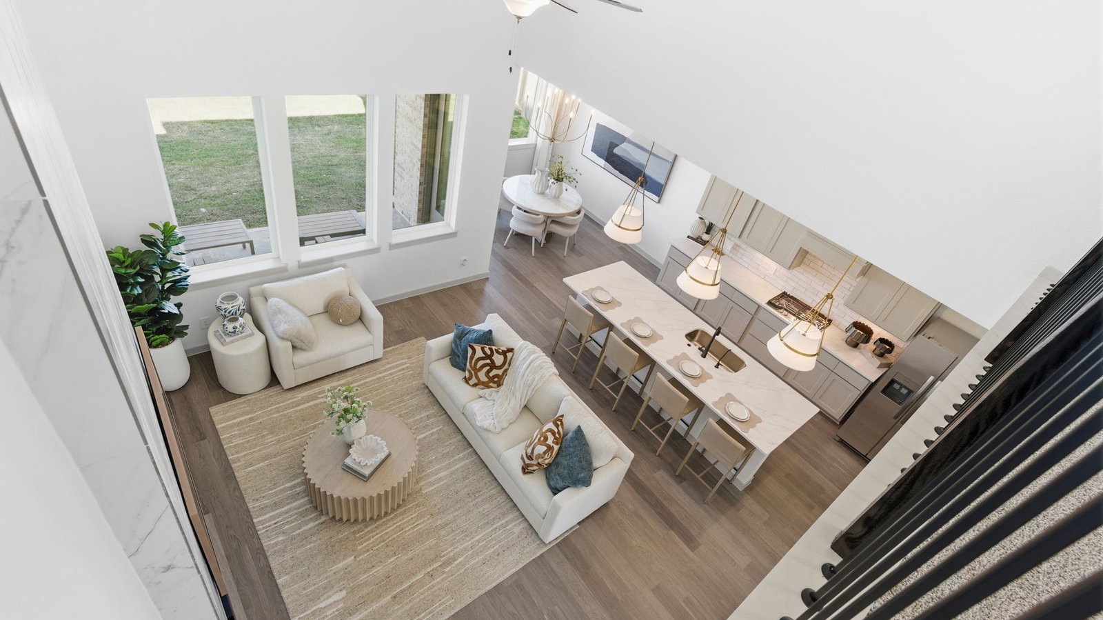 A open-concept living space where the kitchen, family room, and breakfast nook come together