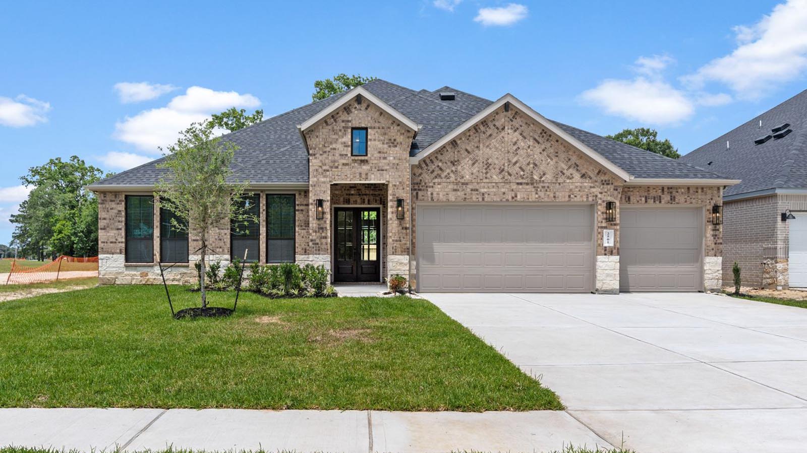 single story home with a three car garage