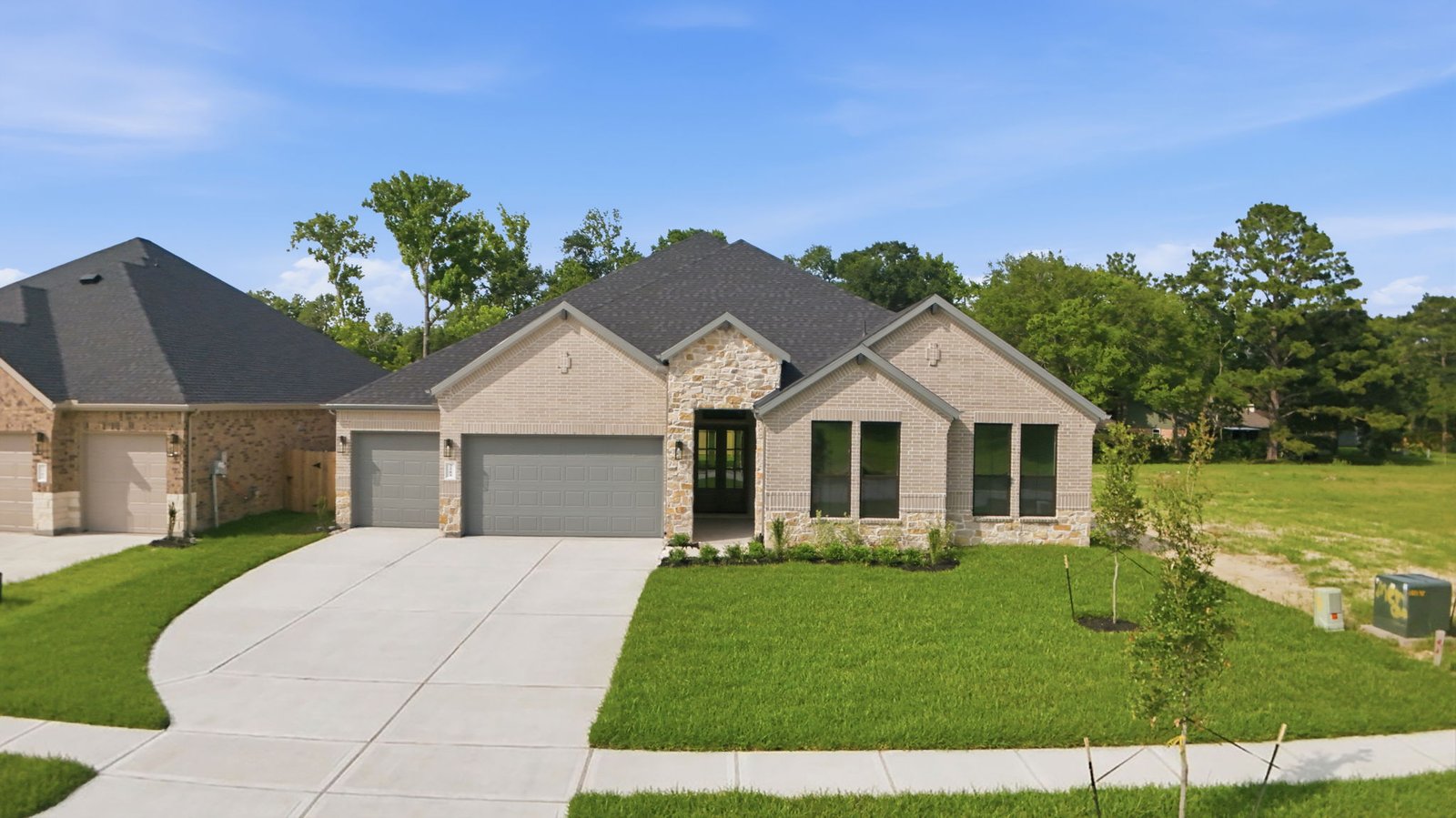 single story home with a three car garage