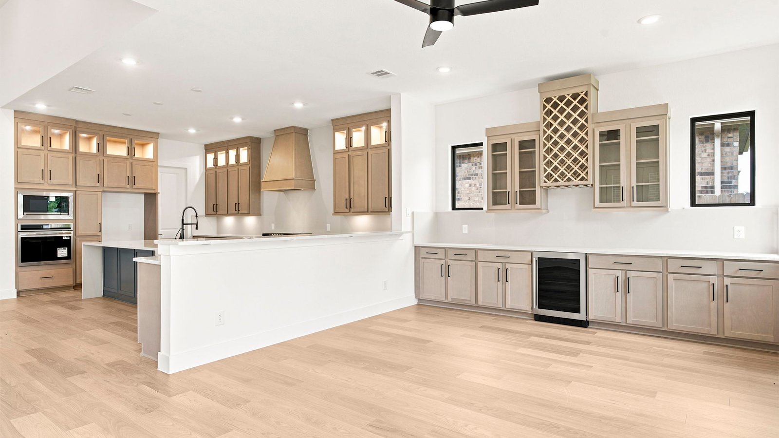 A beverage bar off the living room for social gatherings and additional space for a game room or breakfast nook