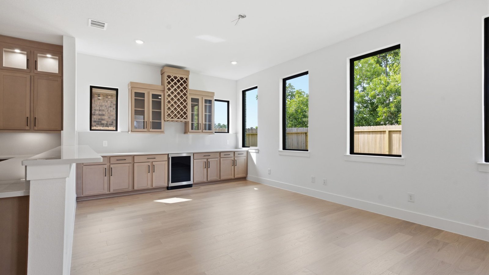 A beverage bar off the living room for social gatherings and additional space for a game room or breakfast nook