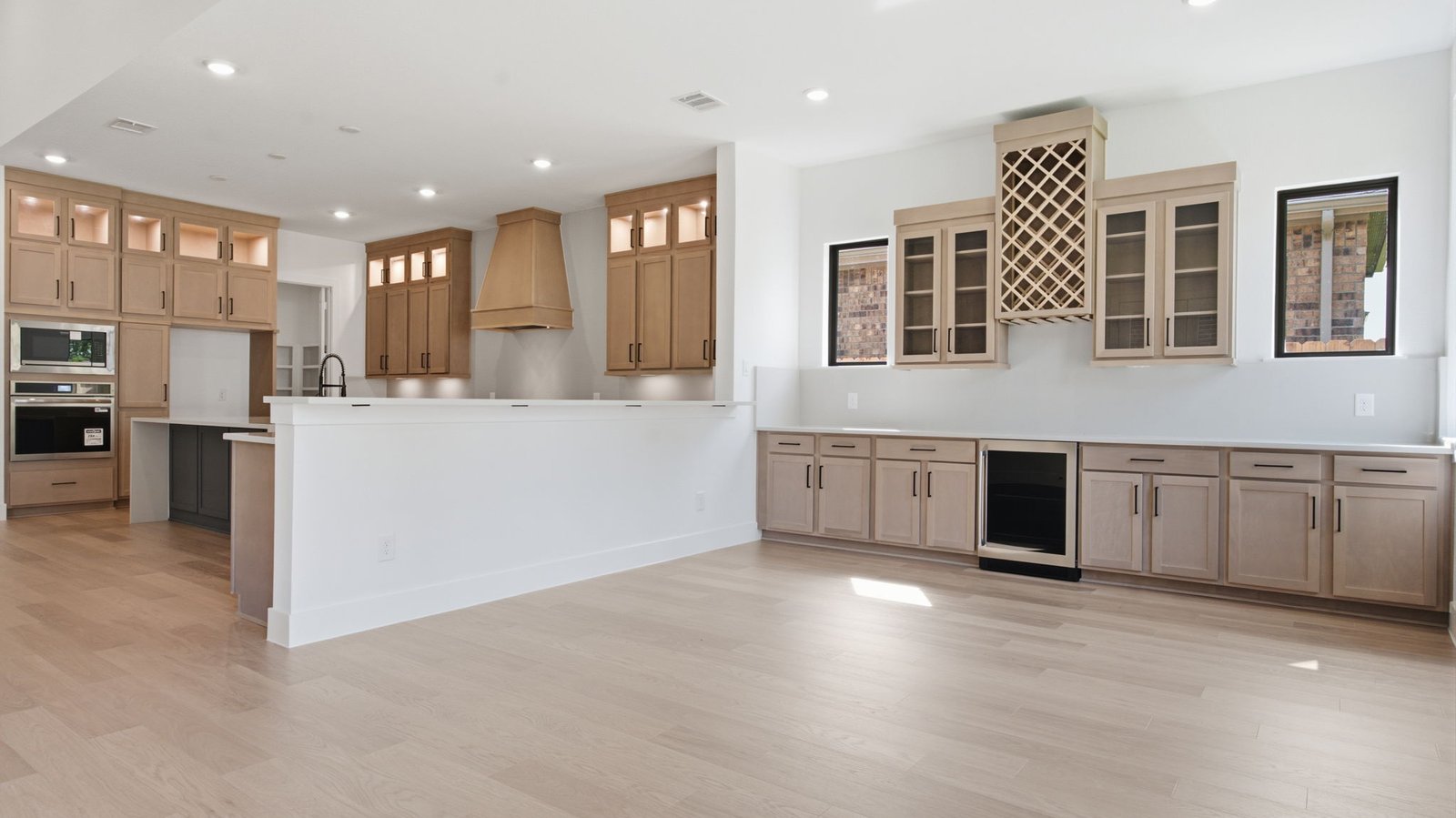 A beverage bar off the living room for social gatherings and additional space for a game room or breakfast nook